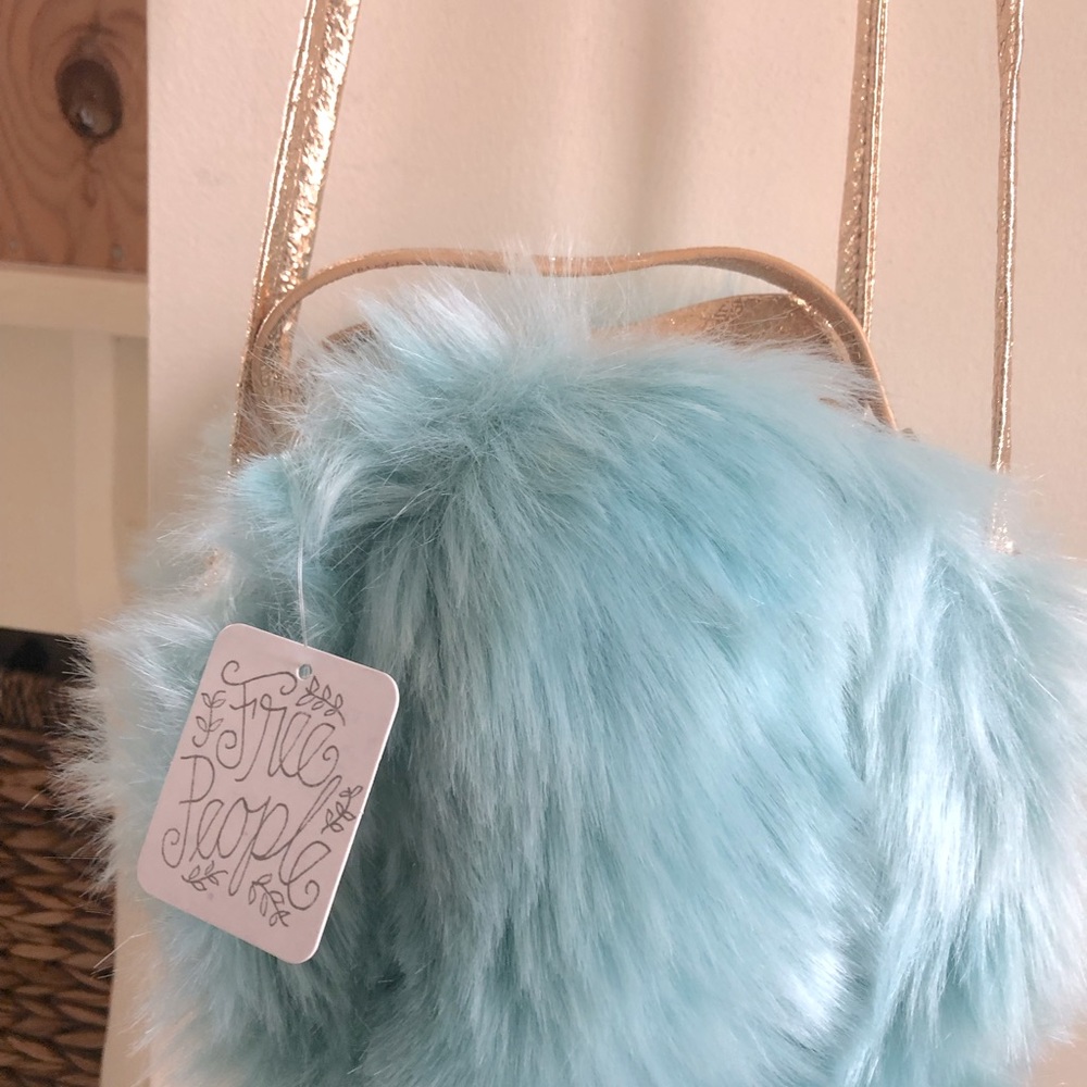 Free People purse brand new with tags.  Never been used. Super fun!